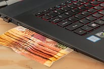 laptop with cash