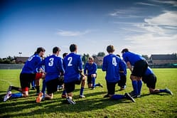 soccer players with blue uniform